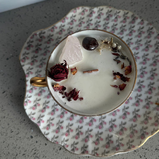 Teacup with dried flowers and leaves on a floral saucer